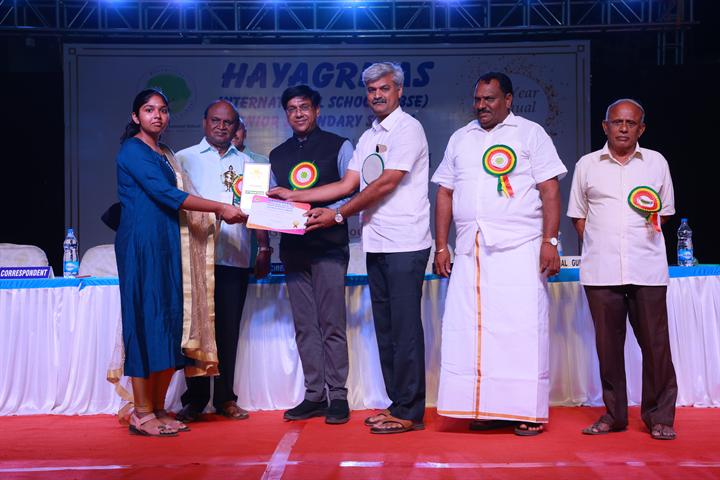 A prize is presented on stage at the Annual Fiesta