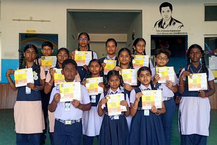 Students holding their certificates