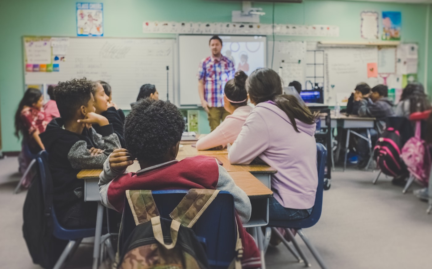 Students engaged in a lesson in a bright classroom